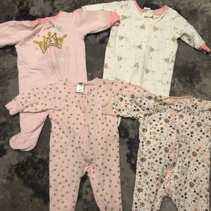 Bundle of 4 3-6month old footed sleepers.